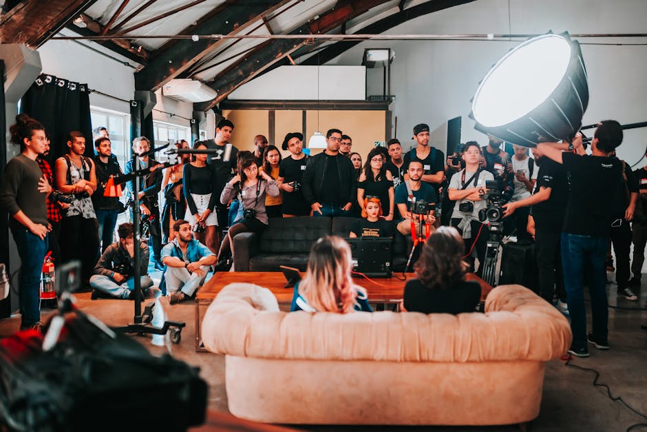 Behind-the-scenes of a photo shoot with a diverse team working together in a SΓ£o Paulo studio.
